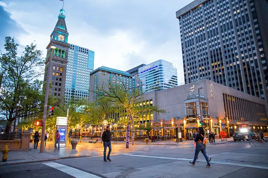 people crossing the street in downtown denver.
